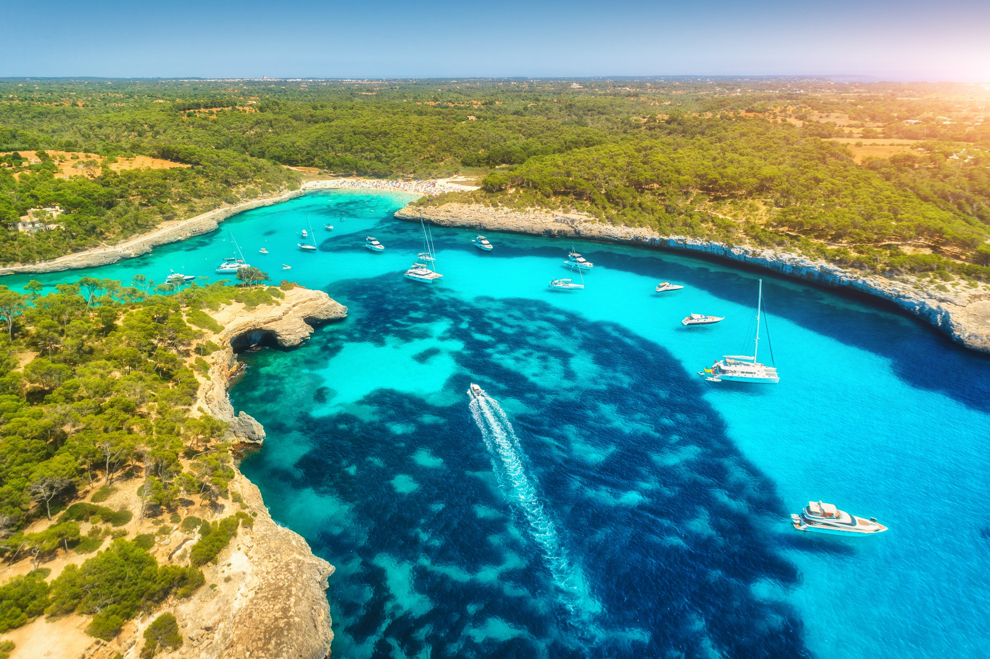 Aerial view of boats, luxury yachts and transparent sea