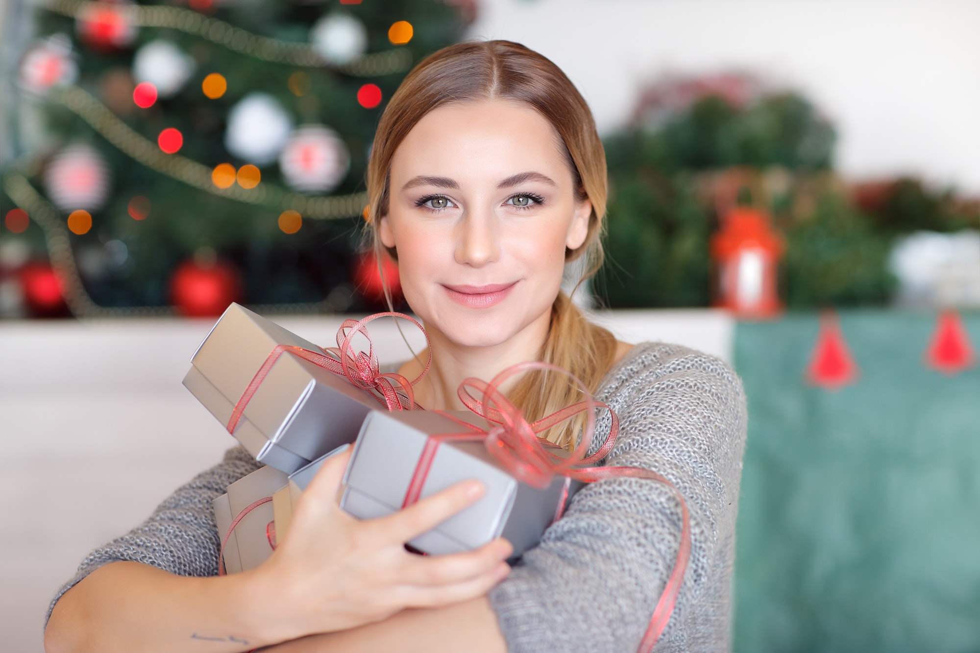 Happy woman with Christmas gifts