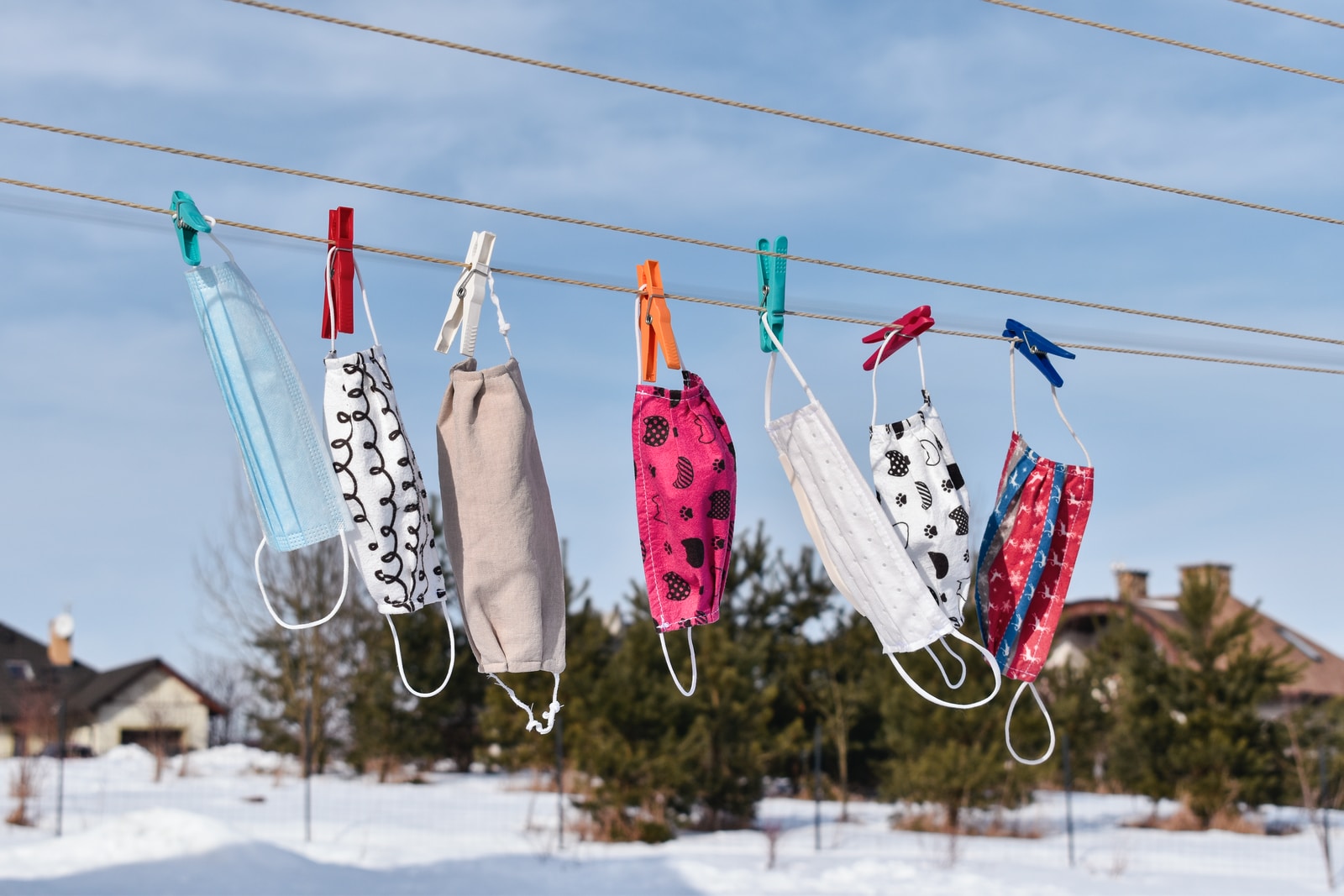 assorted clothes hanging on clothes line